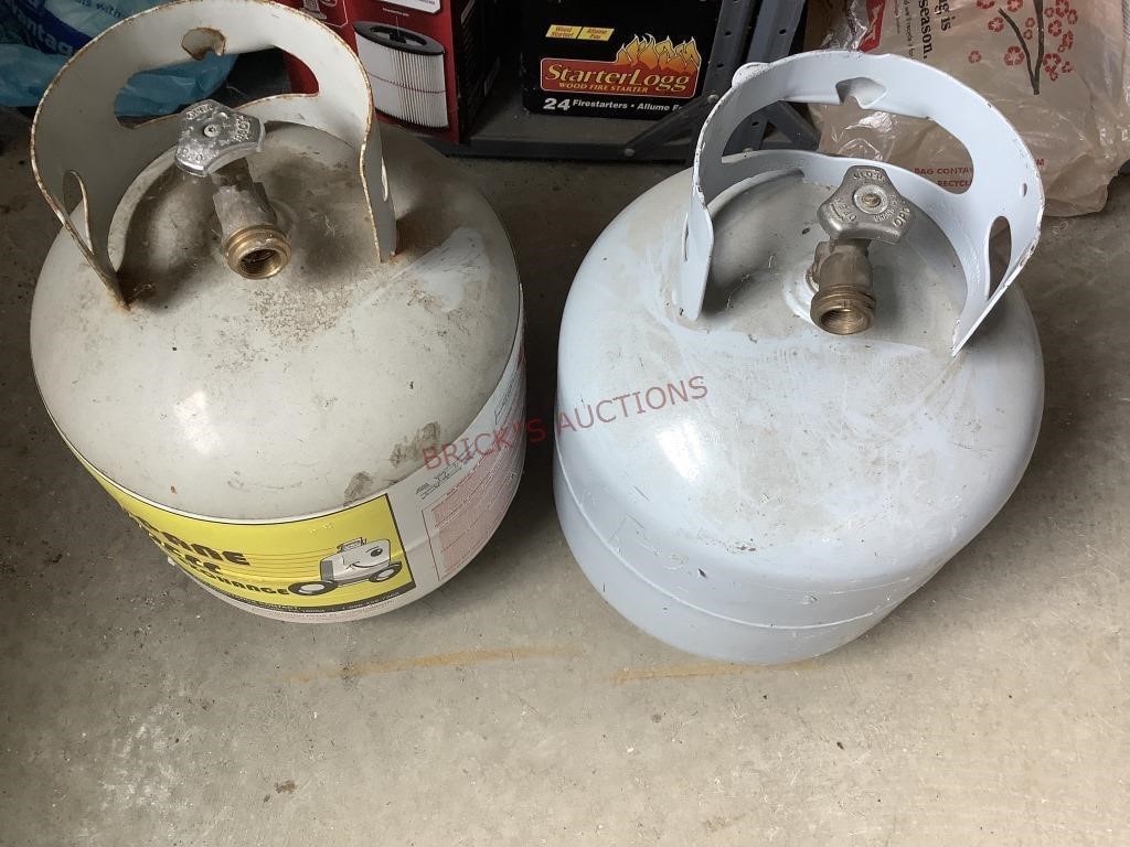 One Empty and One Half Full Propane Tanks