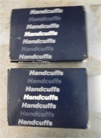 (2) Sets of handcuffs new in box