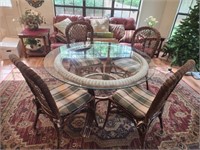 Very Nice Glass and wicker table with four chairs