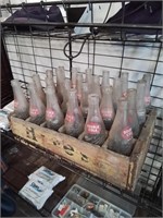 Wooden hires crate of double cola bottle