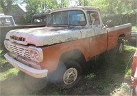 Orange Ford F100 4WD pickup with V8 motor and