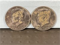 Two 1976D copper nickel clad Kennedy half dollars