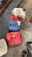 Three gas cans, one water jug