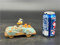 A DISNEY DONALD AND PLUTO TOY ROADSTER SUN RUBBER