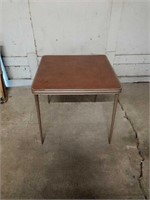 Folding card/game table. Cushioned top, metal