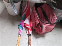 Two Umbrellas and Lunch Bag