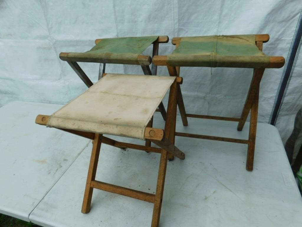 3 fold-up wood and canvas camp stools