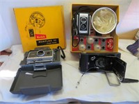 Kodak and Poloroid cameras