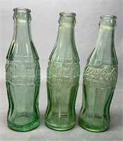 Three Antique Glass Coca Cola Bottles