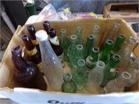 Box of old pop and beer bottles