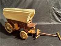 Wooden toy wagon, seems to be missing the horses.