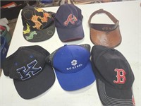 Collection of ball cap hats and a leather sun