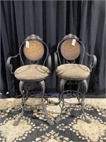 Wonderfully detailed iron and leather bar stools