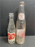 Vintage CB Soda and Big Giant Cola pop bottles.