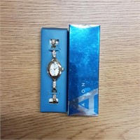 Avon gold tone sparkling crystal bracelet watch