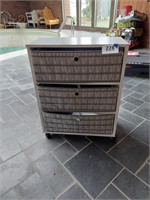 Storage cabinet on casters with 3 cloth baskets,