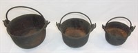 Vintage mini cast iron pots.
