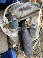 Sack of duck decoys with weights.