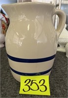 stone pitcher with blue stripes