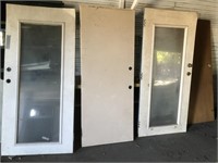 4 doors, the two with glass panels have damage at