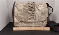 Rebekah Scott designs tan purse