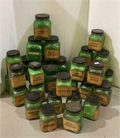 Large collection of green glass medical bottles