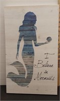 I believe in mermaid's wooden wall decor. 19 5/8