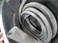 Variety of Hoses in Trash Can