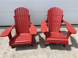 2 red Adirondack style chairs