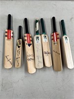 7 miniture signed cricket bats