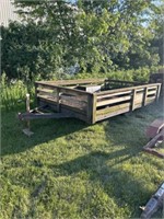 Wood sided steel framed utility trailer.