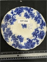 Flow blue plate chips on back
