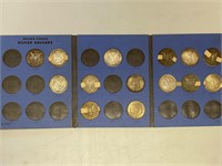 14 - Morgan silver dollars in book