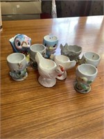 Eight vintage egg cups, and blue birdie creamer
