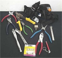 Tie downs, pliers, socket wrench, fuses and a