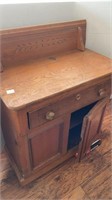 Antique commode, oak with carved backboard,