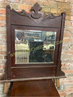 Antique wood framed beveled mirror