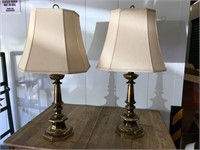 Pair of brass lamps with matching shades.