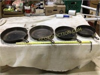 4 unbranded cast iron skillets, #’s 12,12,10,8