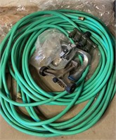 Box Lot of Green Garden Hoses and Sprinklers