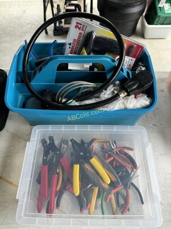 Clear bin filled with wire strippers, cutters,