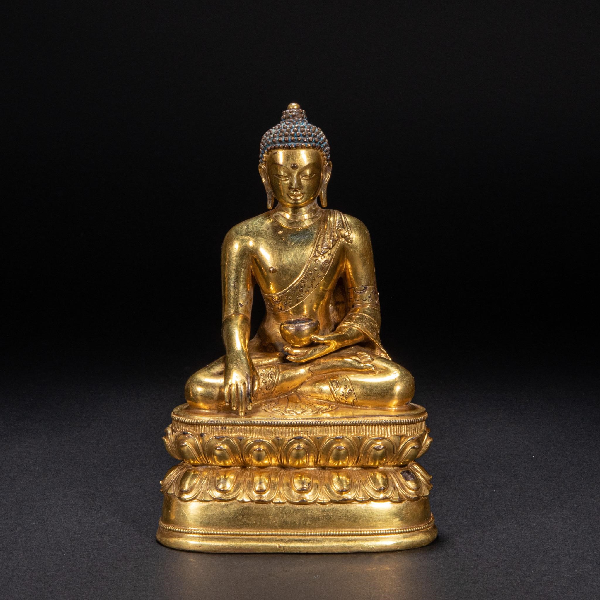Bronze gilded Buddha statue