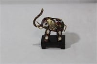 A Small Chinese Cloisonne Elephant on Stand
