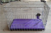 42x20x30 Dog crate with water bucket and pad.