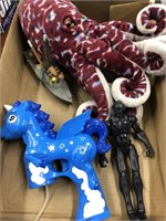 Box full of toys unicorn , squirt gun , octopus