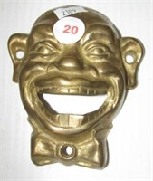 Brass black memorabilia face. Measures 4" tall.