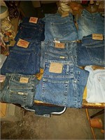 9 pair of used Levi Strauss blue jeans in various