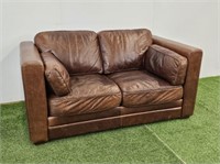 TAN LEATHER LOVESEAT - 66" LONG X 39" D X 36" H