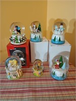 6 snow globes. 1 is precious moments and 1 is