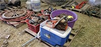 Pallet of horseshoes with igloo cooler